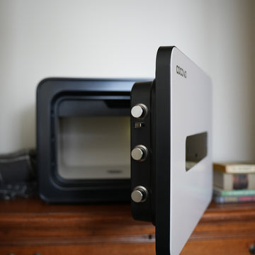 Cocono 20 small fireproof closet safe in Ivory, highlighting bolts.