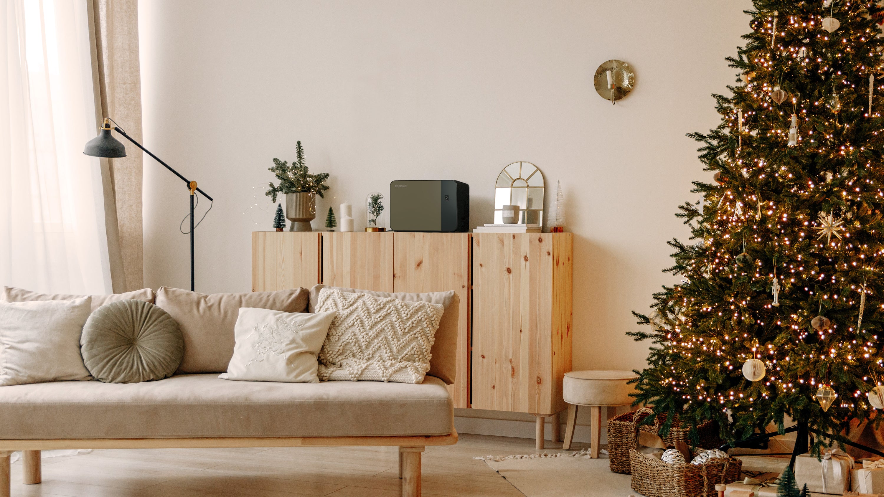 Cocono Chroma 15 Fireproof Biometric Mini Safe in Turtle next to a Christmas