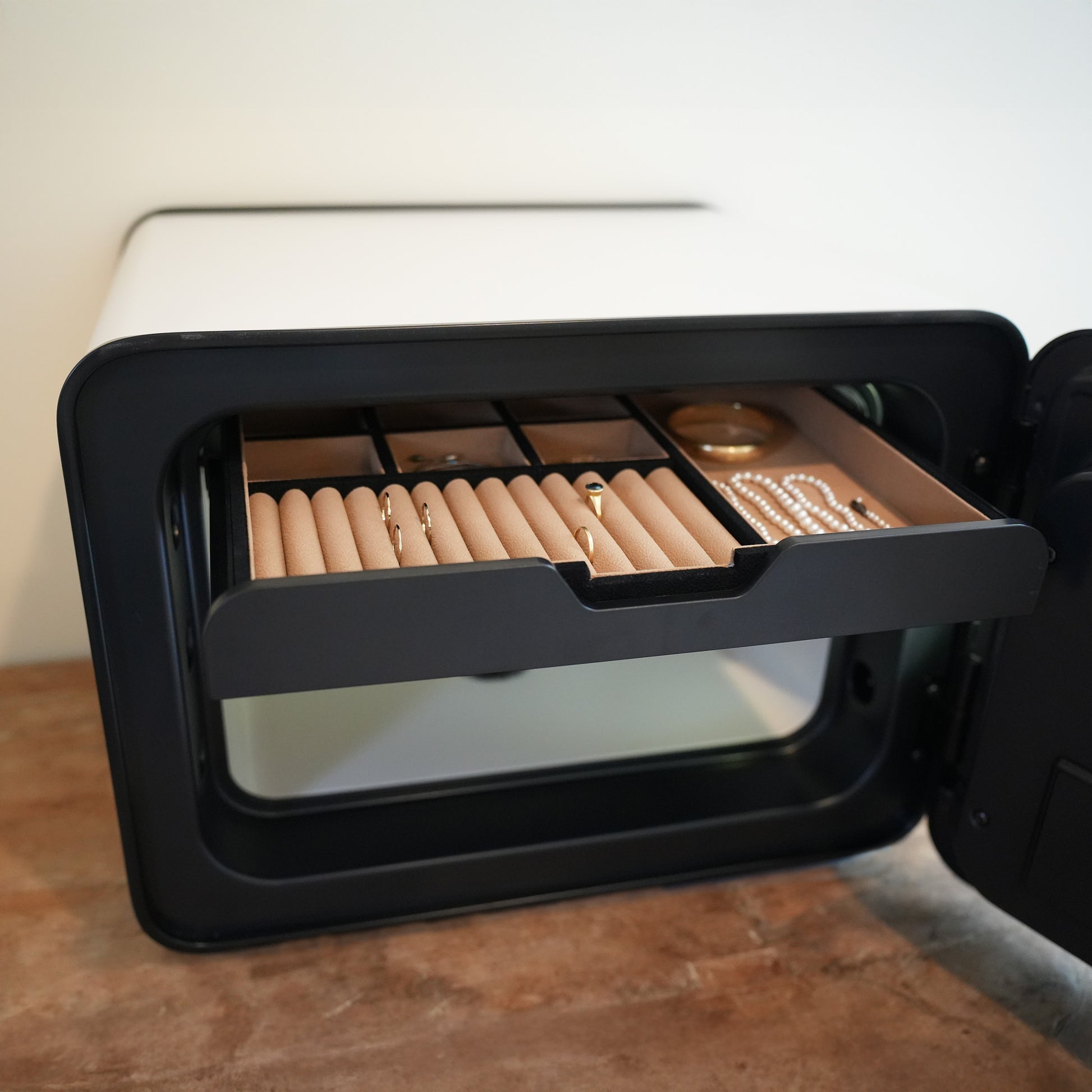 Cocono 20 small safe Jewelry Organizer shown in a compact safe.