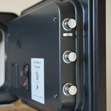 Small fire resistant safe: close up of the active bolts on the door of a Cocono 20 small household safe.