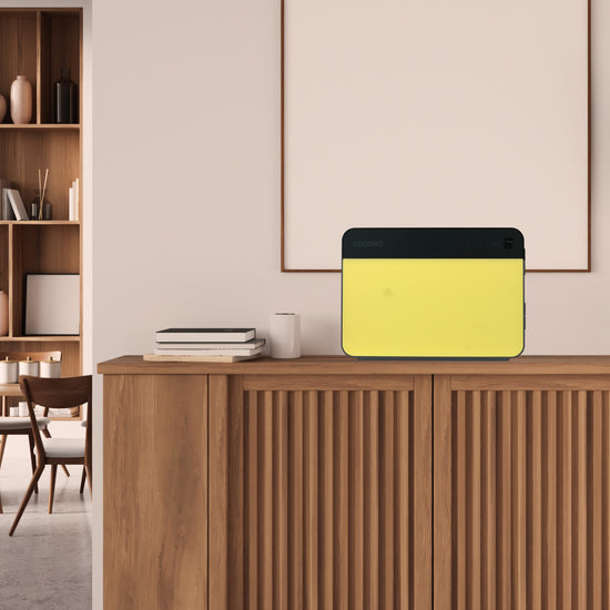 Cocono Chroma 20 Small safe in Lemon on a credenza