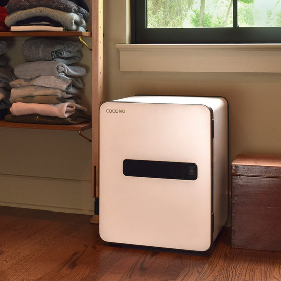 Medium size safe: Ivory Cocono 40 fire resistant home safe shown in home closet, designed as a fireproof office safe for secure storage and organization.