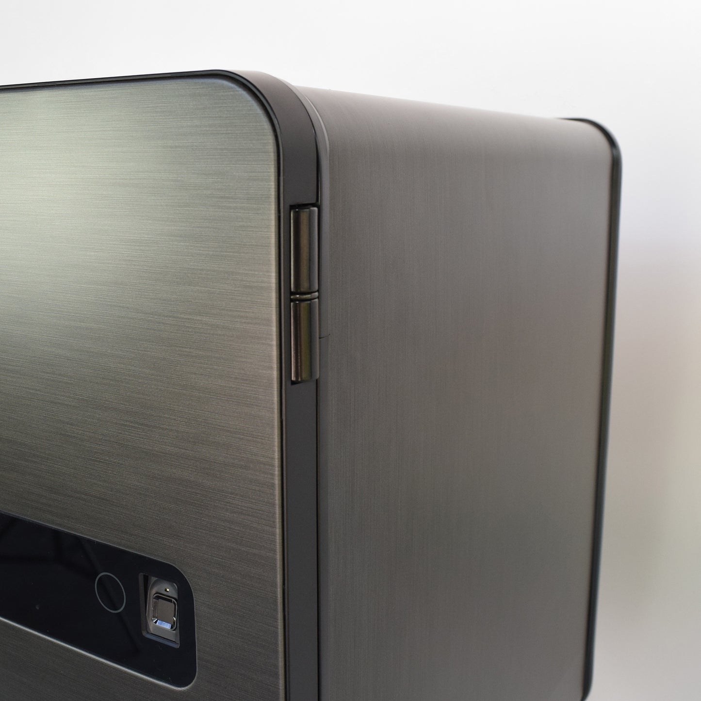Medium size safe: Graphite Cocono 40 home safe hinge detail and biometric fingerprint reader.