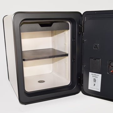 Photo of the customizable interior of a modern, white, 40 liter Cocono safe for organization and secure storage.